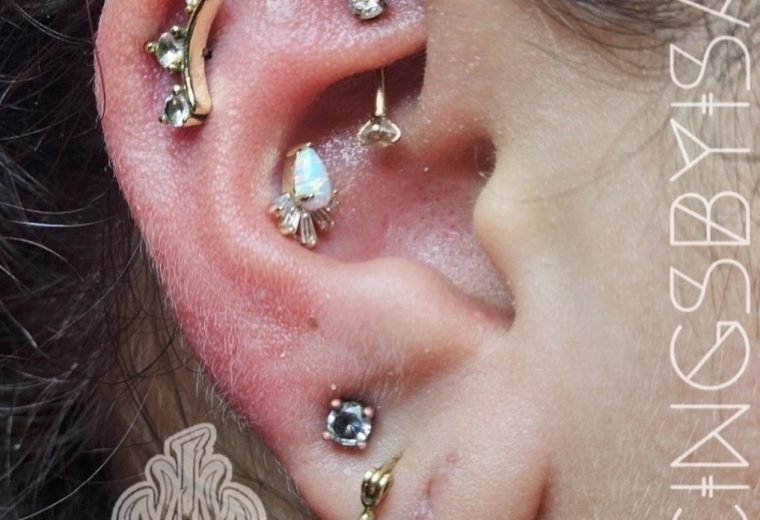 Curated ear with multiple cartilage piercings, San Diego